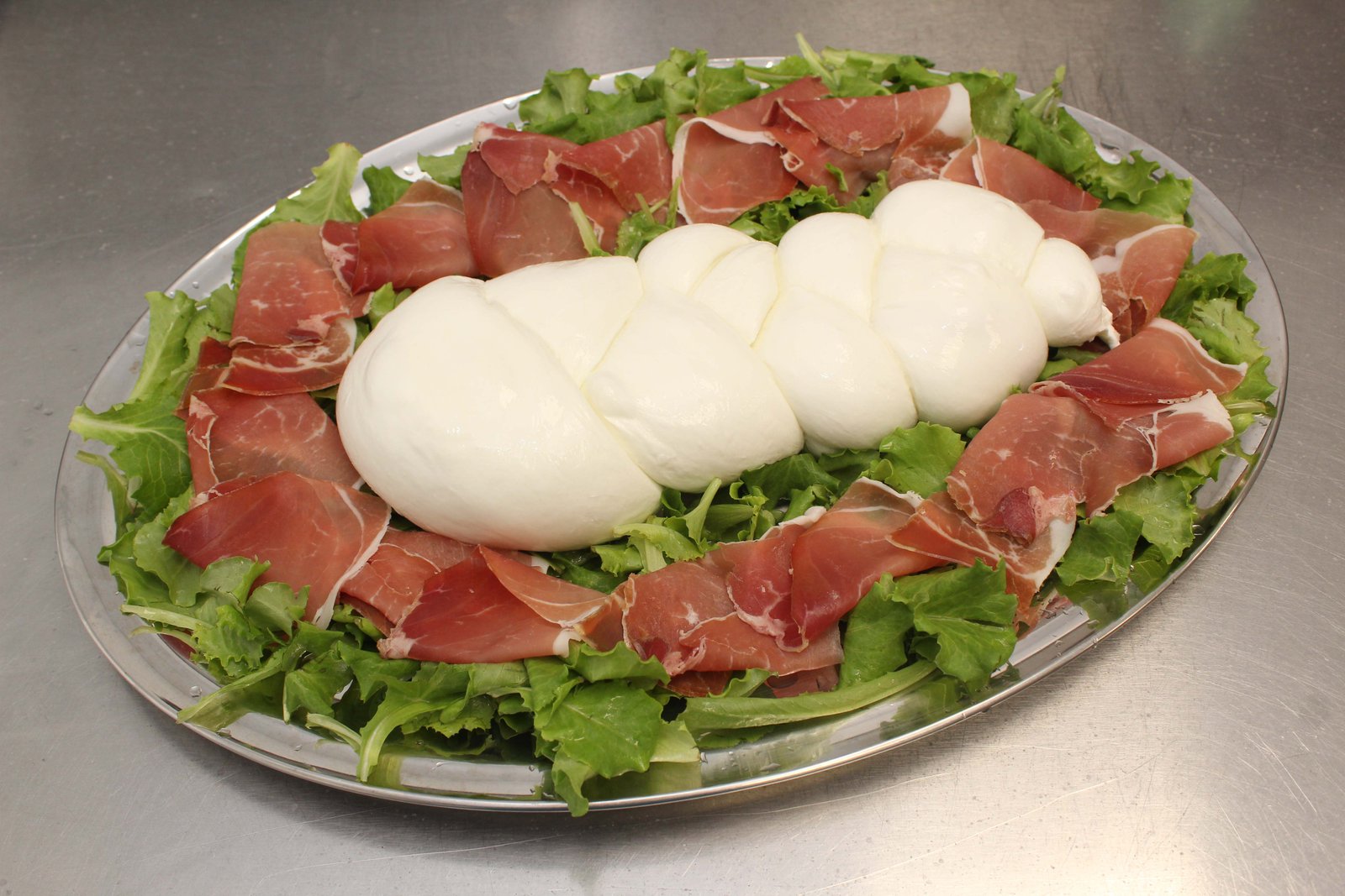 Treccia prosciutto e rucola